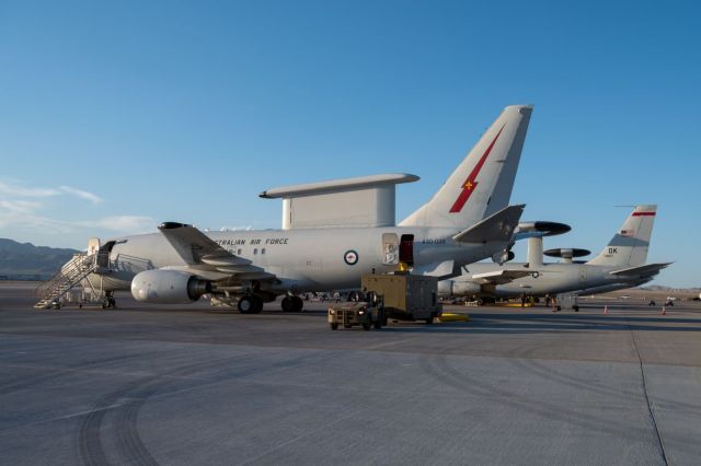 A Royal Australian Air Force E-7A Wedgetail aircraft assigned to the No. 2 Squadron based in Williamtown, Australia, sits next to a U.S. Air Force E-3 Sentry assigned to the 552nd Air Control Wing, Tinker Air Force Base (AFB), prior to a Weapons School Integration mission at Nellis AFB, Nevada, June 7, 2024. The E-7A Wedgetail is capable of simultaneously tracking airborne and maritime targets. (U.S. Air Force photo by Airman 1st Class Brianna Vetro)